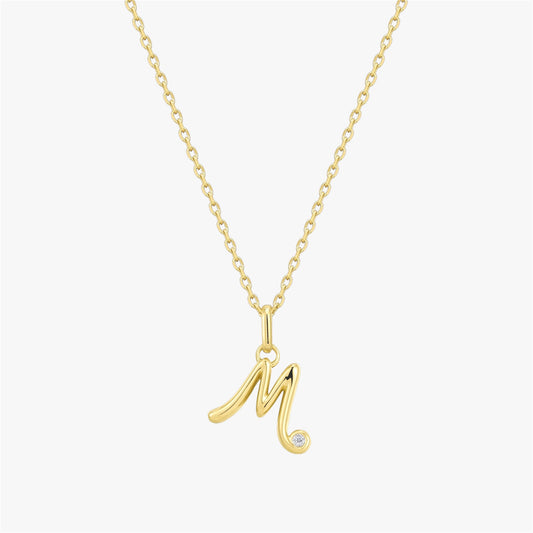Magnolia initial pendant with cubic zirconia stones on 18K gold-plated setting by Shreedha Jewels